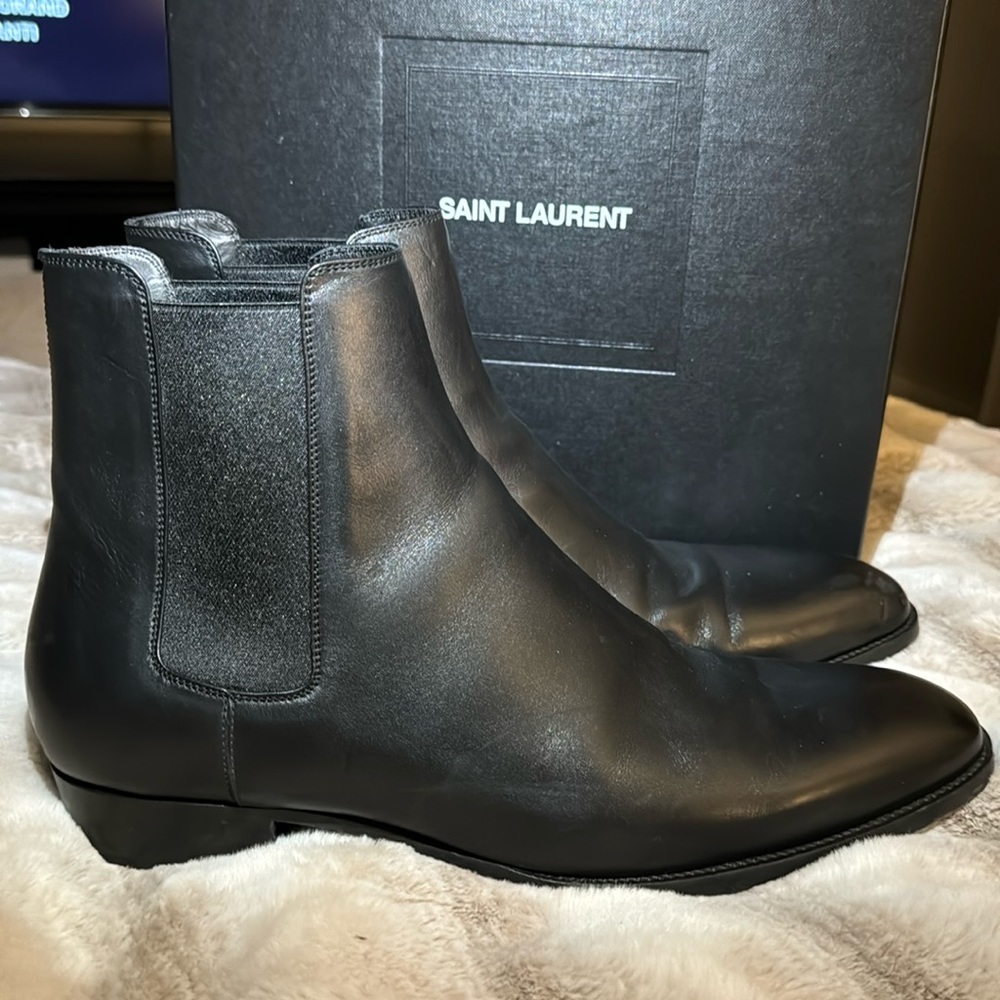 YSL boots. .  No scuff marks condition perfect black leather.  Still in the box